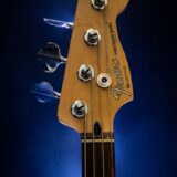 close up photography of brown fender guitar headstock